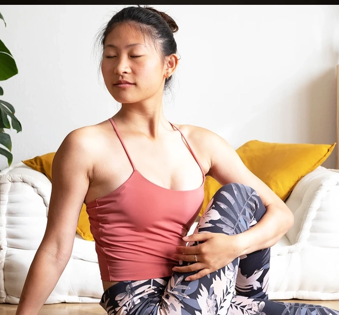 Woman stretching calmly at home